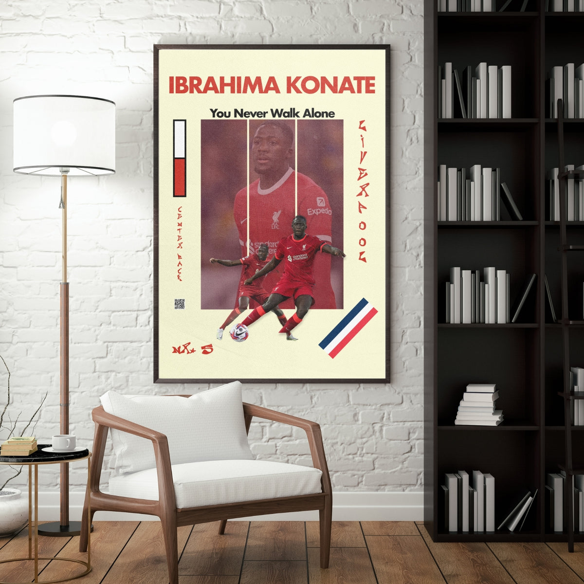 Ibrahima Konate football poster displayed in a modern interior with a dark frame