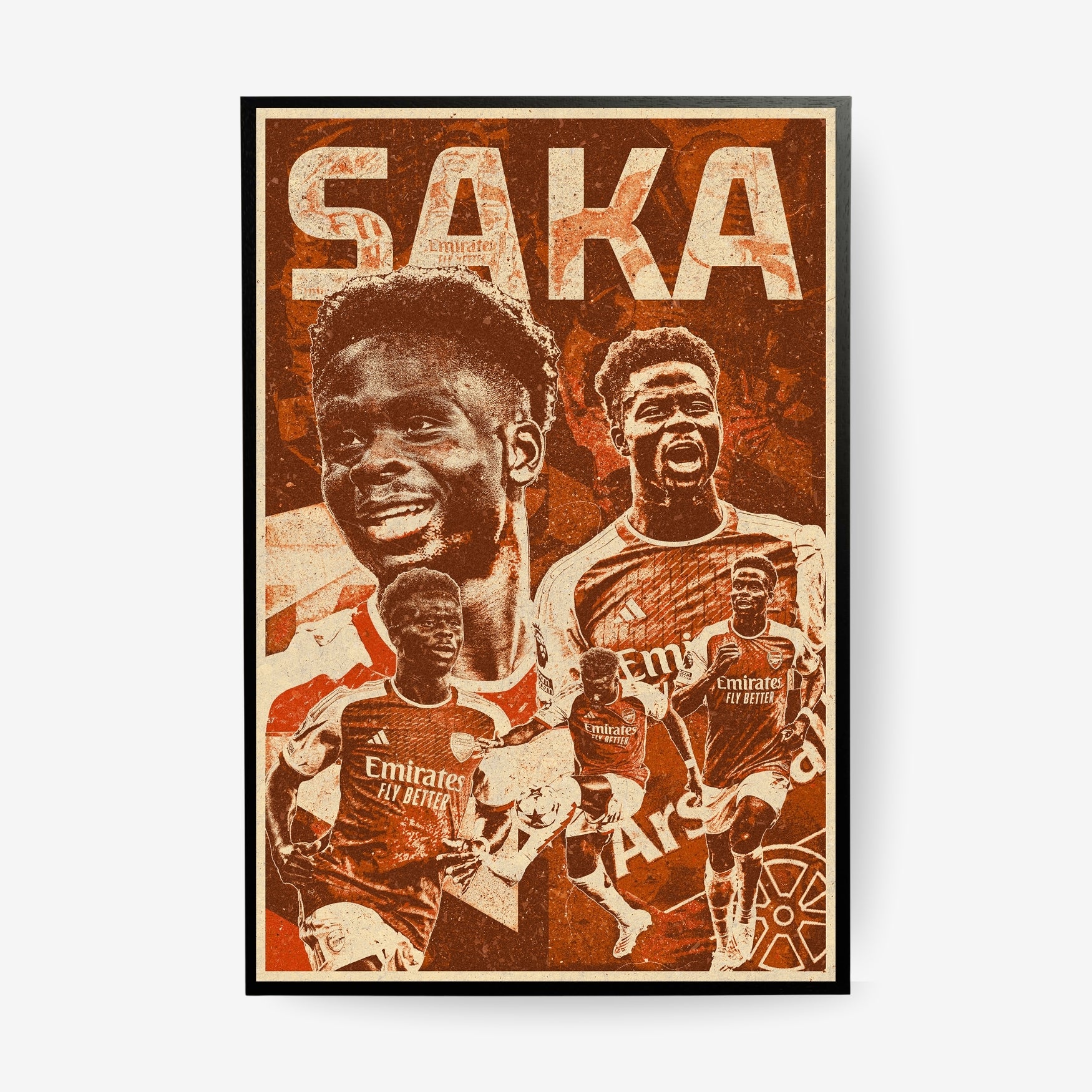 Bukayo Saka Arsenal poster in a black frame featuring a vintage red football collage