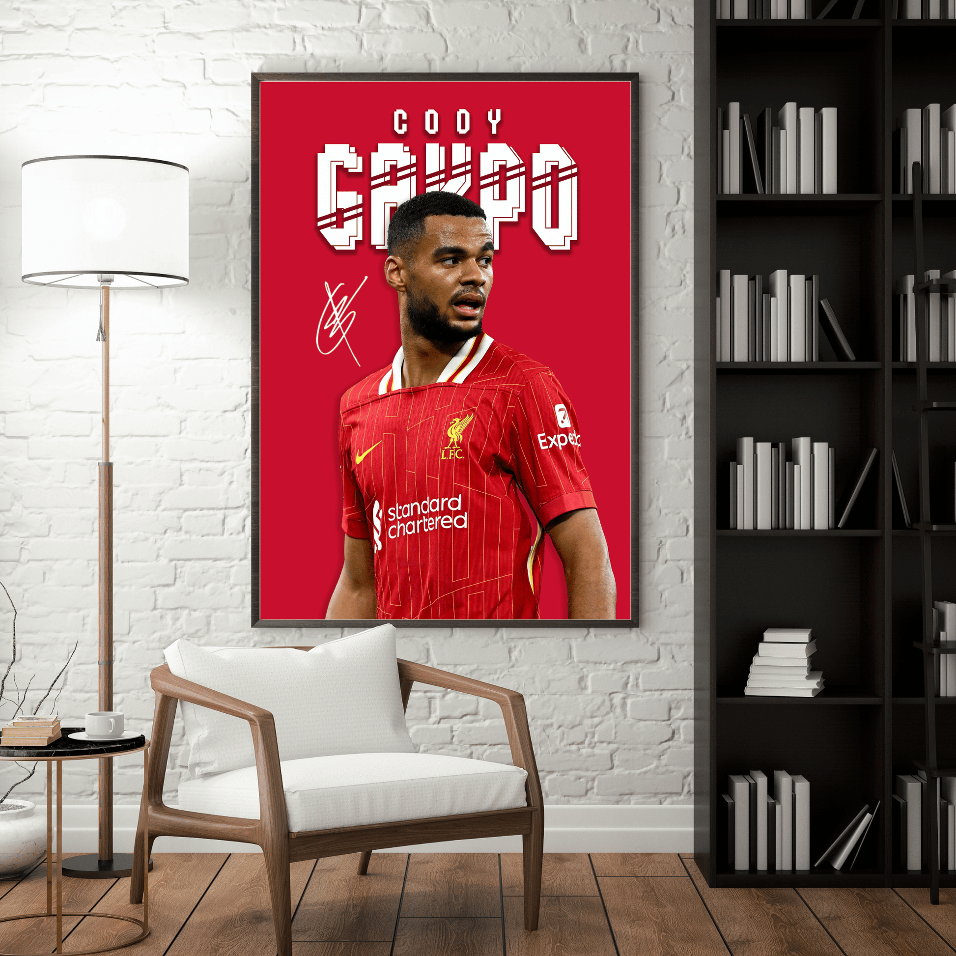 Framed poster of a soccer player in a red jersey on a wall in a room with a chair and bookshelf.