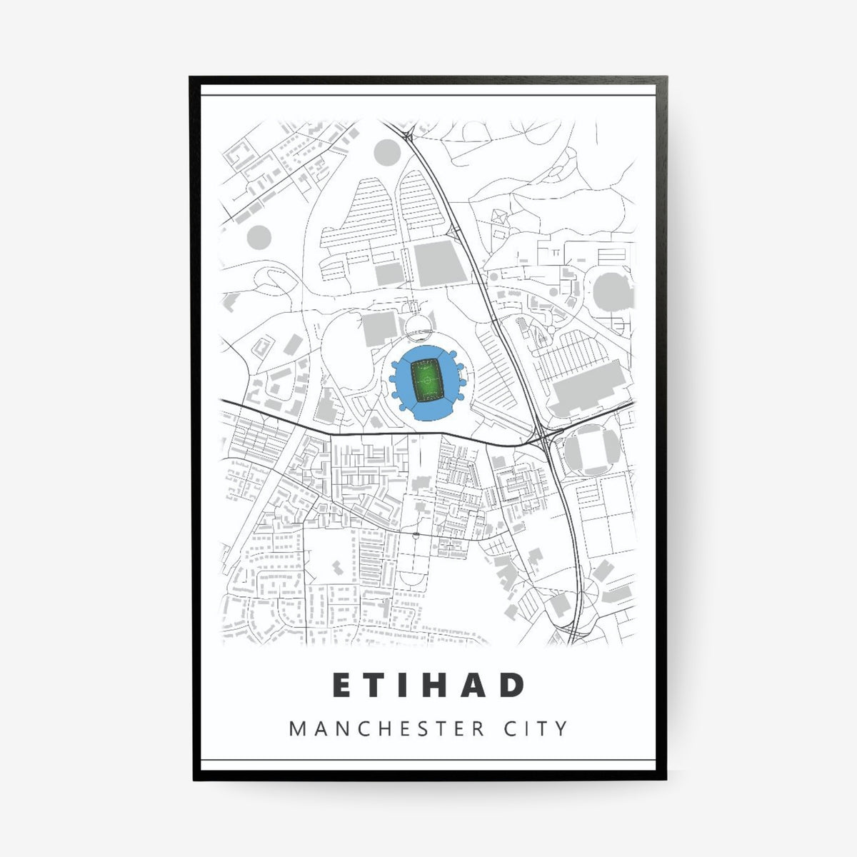 Etihad Manchester City stadium map poster in a black frame featuring a minimalist city map with the iconic football stadium highlighted in blue
