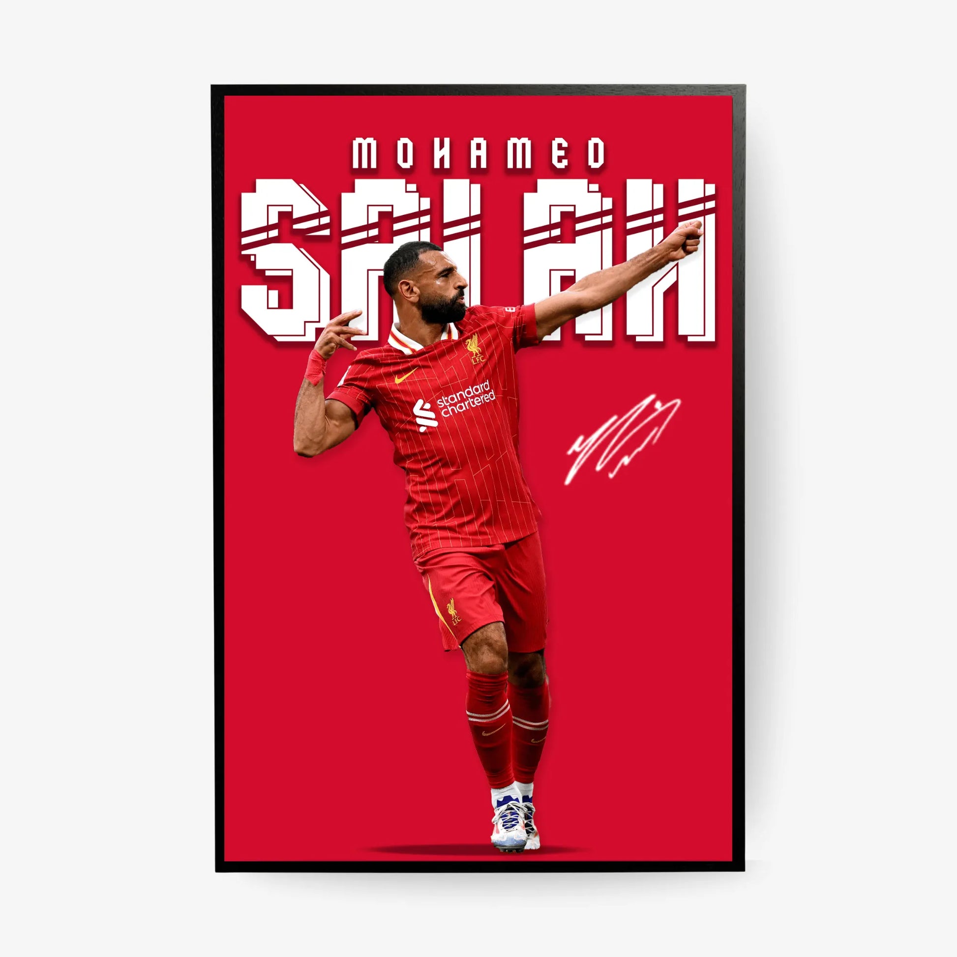 Framed poster of a soccer player in red uniform with 'Mohamed Salah' text on a red background.