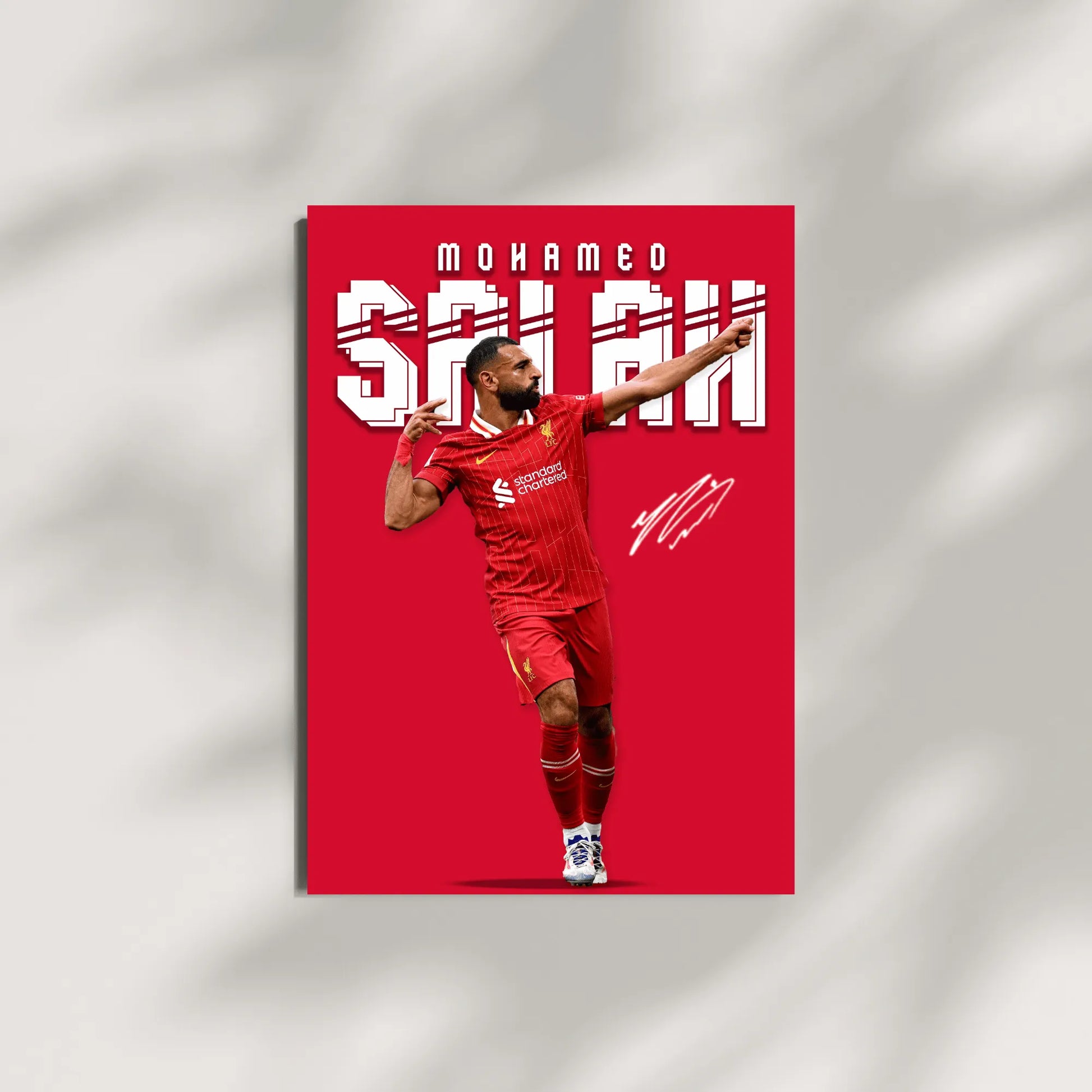 Soccer player in red uniform with 'Mohamed Salah' text on a red background