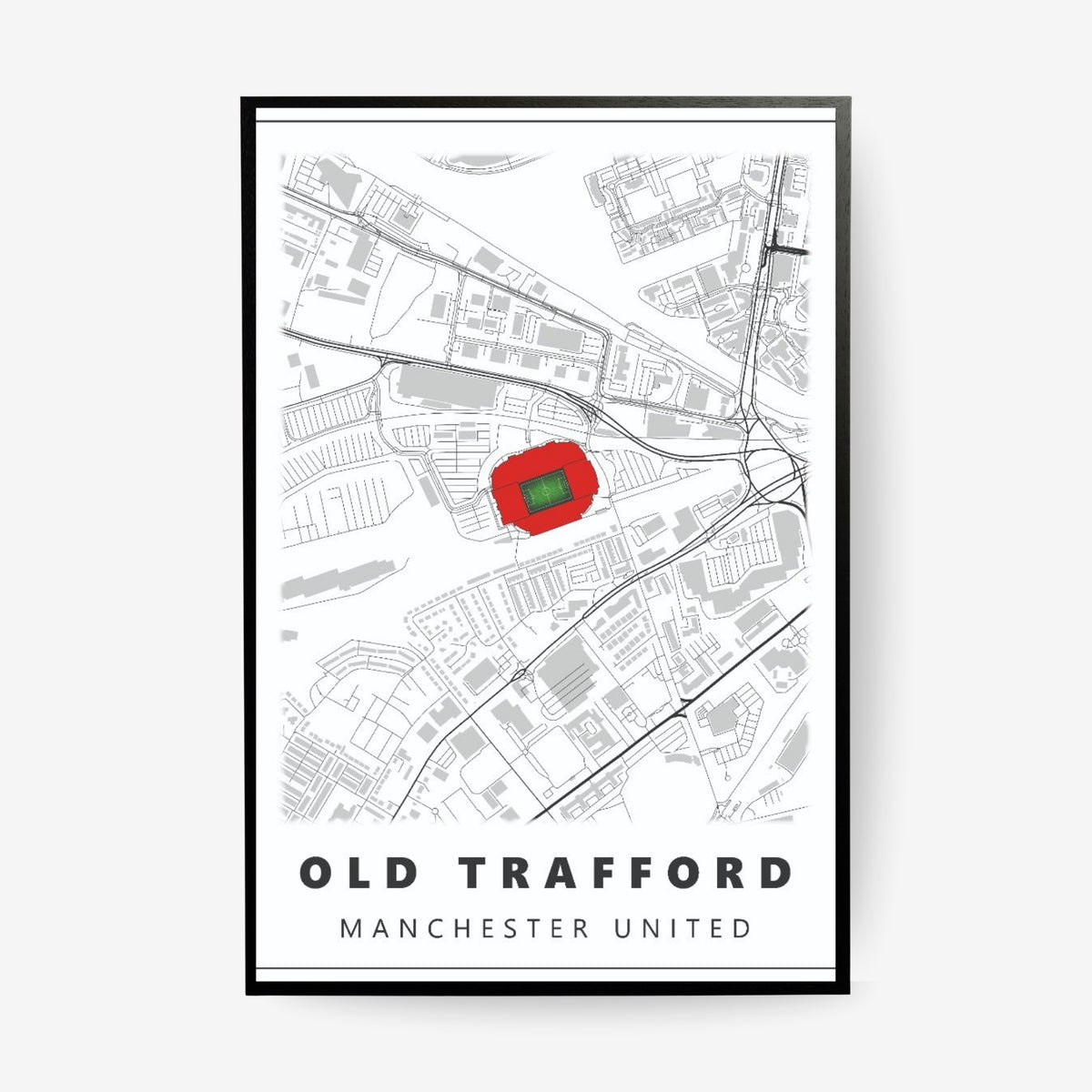 Old Trafford Manchester United stadium map poster in a black frame featuring a minimalist Manchester map with the iconic football stadium highlighted in red