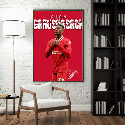 Framed poster of a soccer player in a red jersey on a wall in a room with a chair and bookshelf.