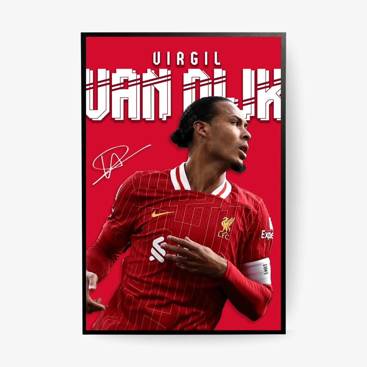 Framed poster of a soccer player in a red jersey with visible branding on a red background.